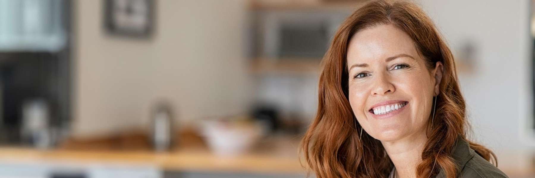 A woman smiling with white teeth