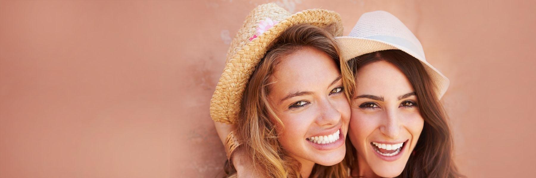 Two friends smiling | tooth loss Vienna VA