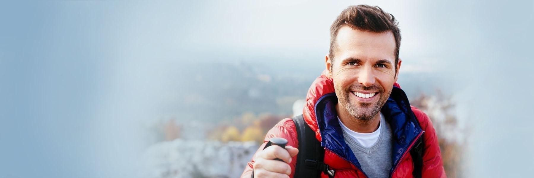 Hiking man smiling | Dentist Vienna VA