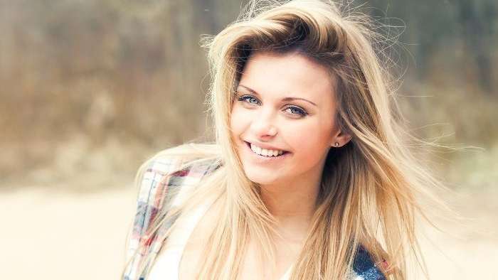 A smiling woman | dentist in Vienna, VA