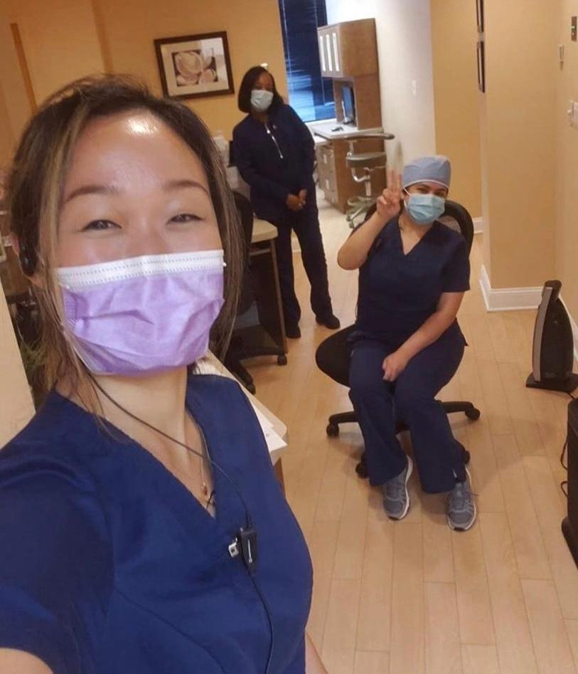 Team members waiving wearing protective masks