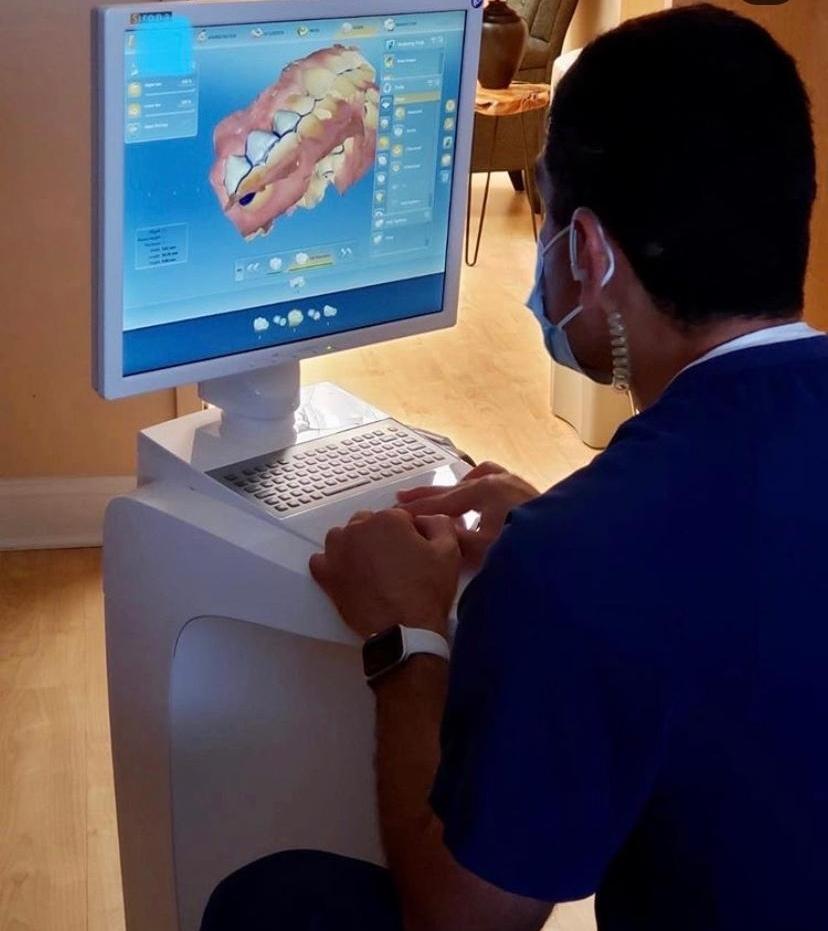 Doctor designing one visit crown digitally in office