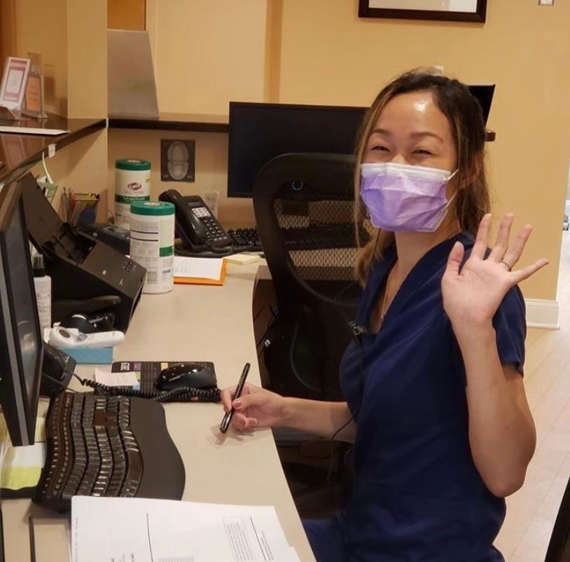 Office Manager waiving wearing protective mask