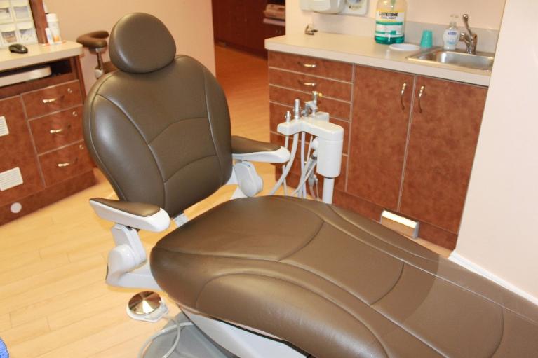 a brown dental chair in a dental operatory | dentist in vienna, va